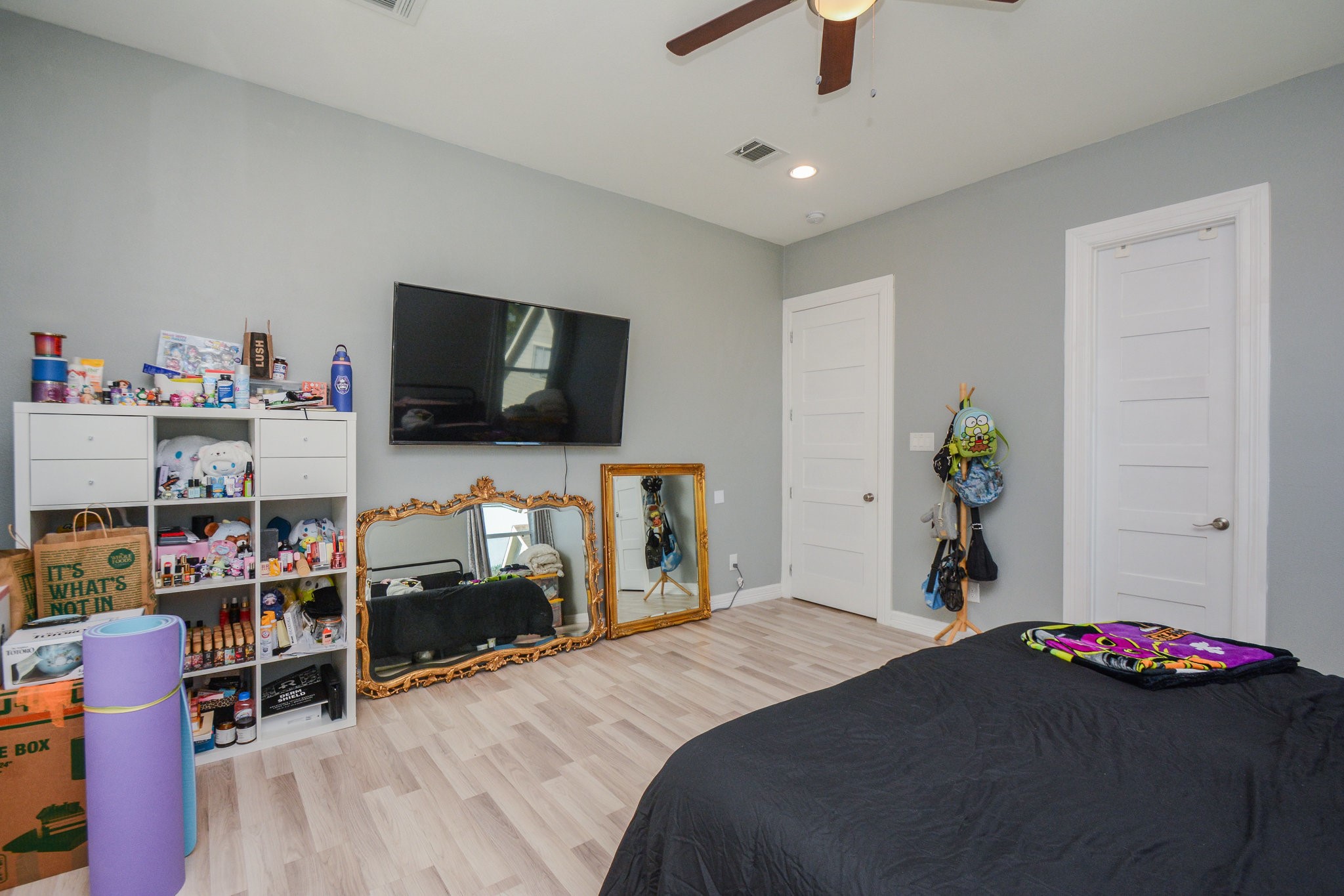 5513 Lotus Street Houston, TX 77085 - Photo 37 of 50 a bedroom with a bed and a flat screen tv