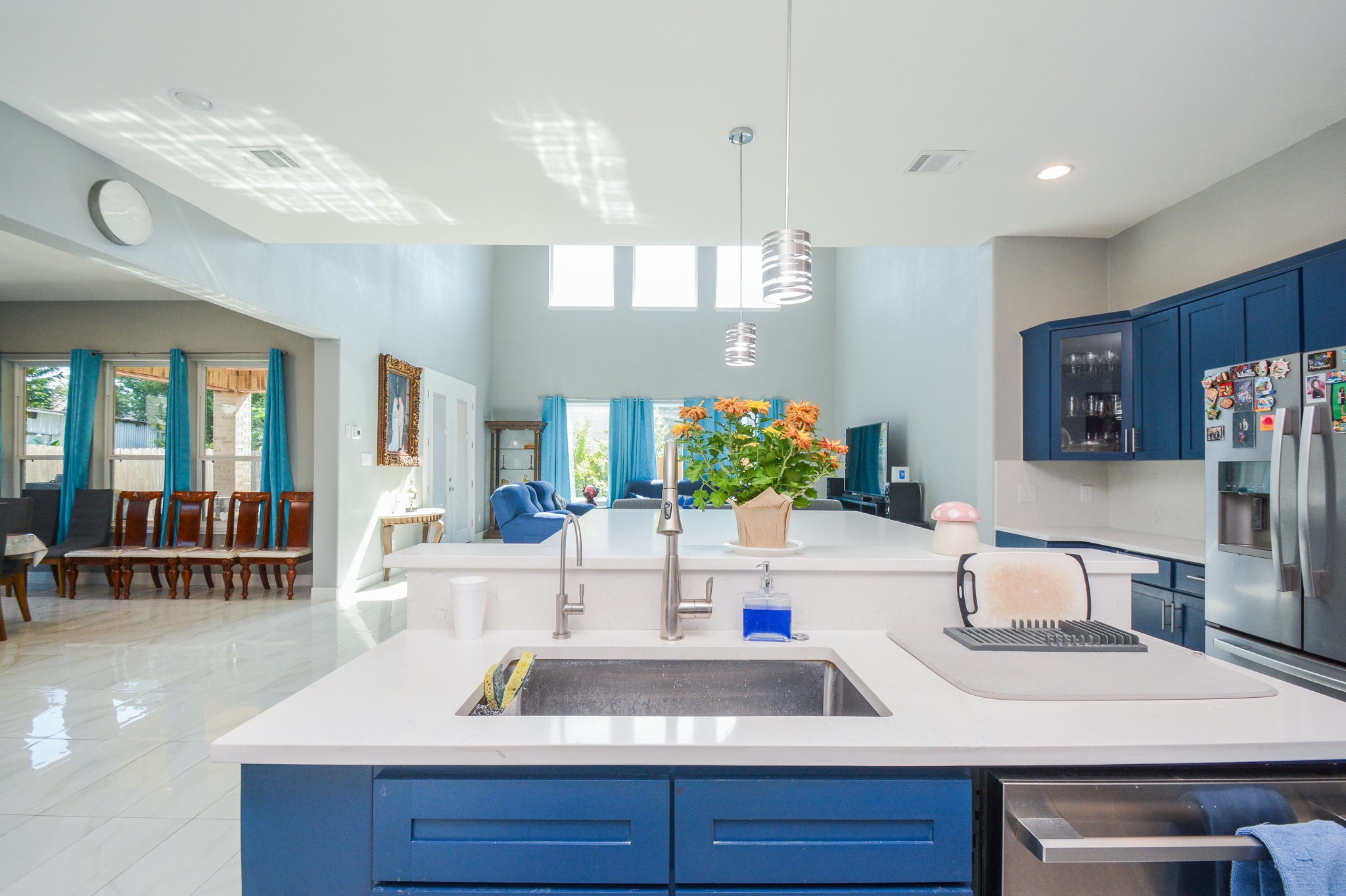5513 Lotus Street Houston, TX 77085 - Photo 4 of 50 a kitchen with a sink and a refrigerator