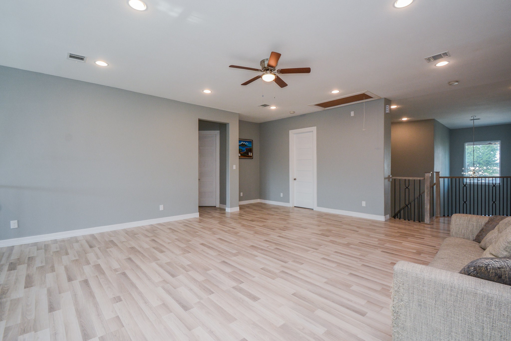 5513 Lotus Street Houston, TX 77085 - Photo 48 of 50 a view of a livingroom with a ceiling fan wooden floor and a ceiling fan
