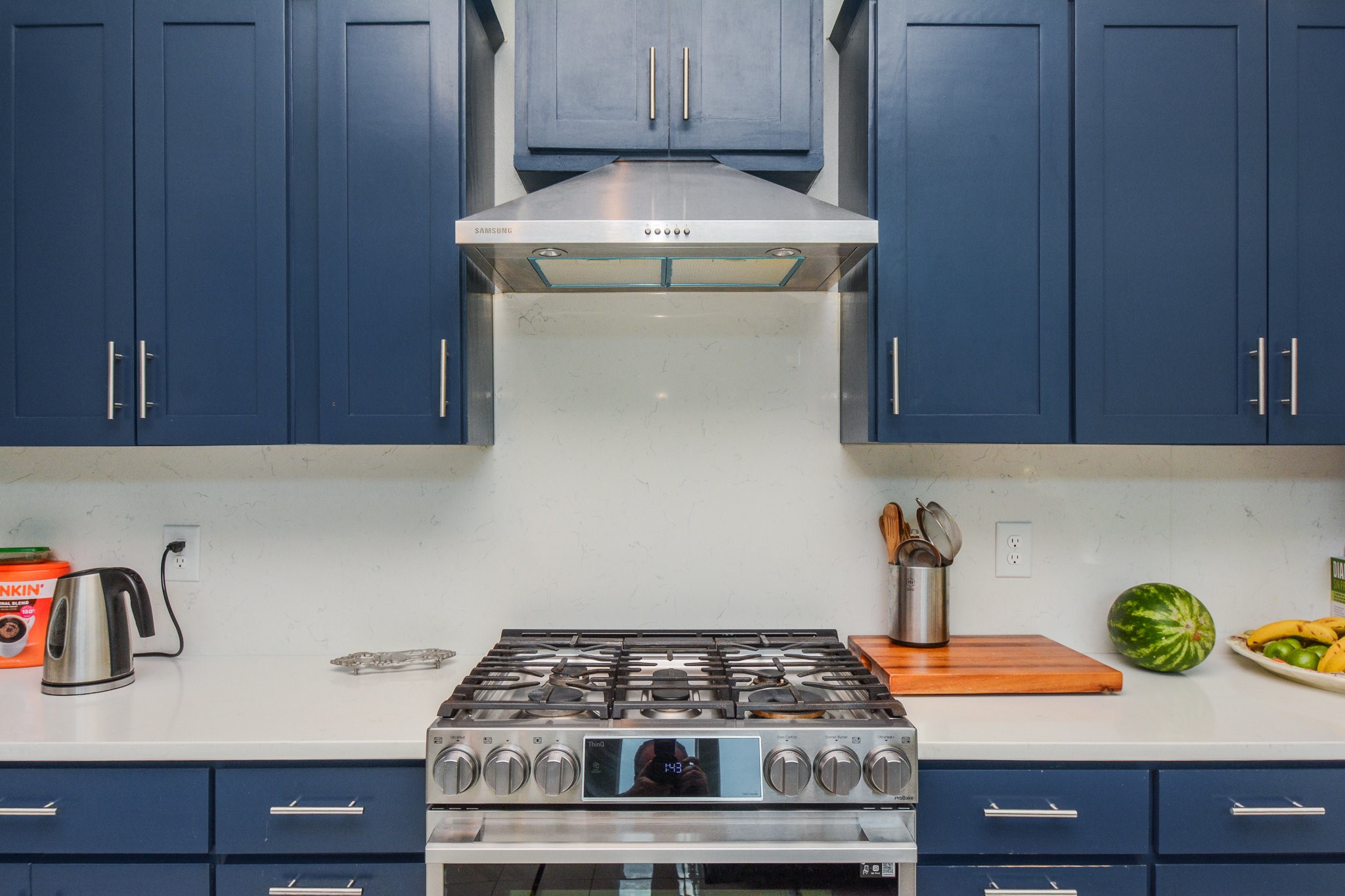 5513 Lotus Street Houston, TX 77085 - Photo 8 of 50 a kitchen with a stove and cabinets