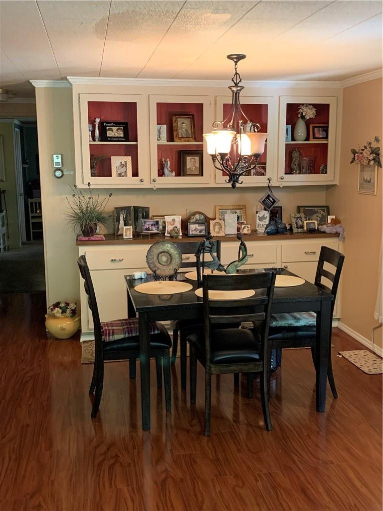 8257 East Club Road Boca Raton, FL 33433 - Photo 12 of 28 a view of a dining room with furniture and wooden floor
