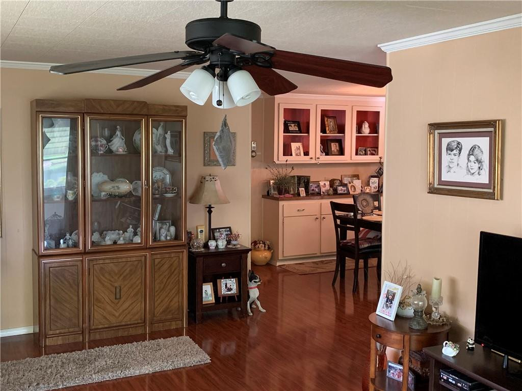 8257 East Club Road Boca Raton, FL 33433 - Photo 16 of 28 a view of a dining room with furniture window and wooden floor