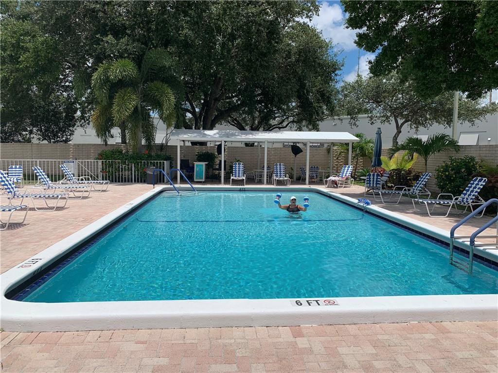 8257 East Club Road Boca Raton, FL 33433 - Photo 22 of 28 a view of a house with swimming pool