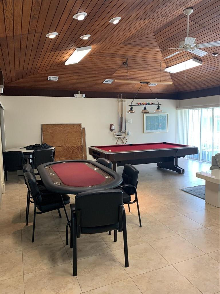8257 East Club Road Boca Raton, FL 33433 - Photo 23 of 28 a dining room with a table and chairs