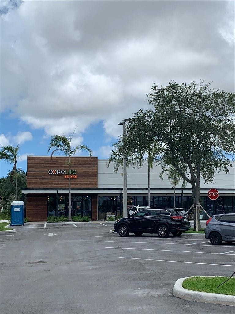 8257 East Club Road Boca Raton, FL 33433 - Photo 26 of 28 a view of a car parked in front of a house