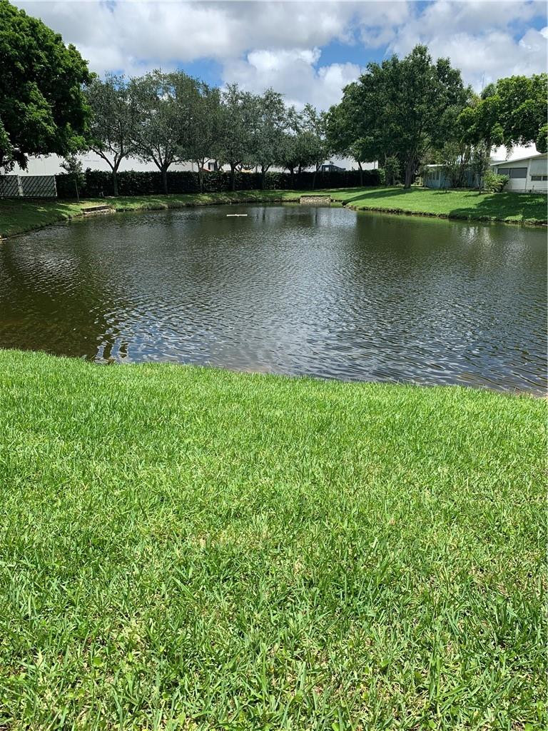 8257 East Club Road Boca Raton, FL 33433 - Photo 9 of 28 a view of a lake with a city view