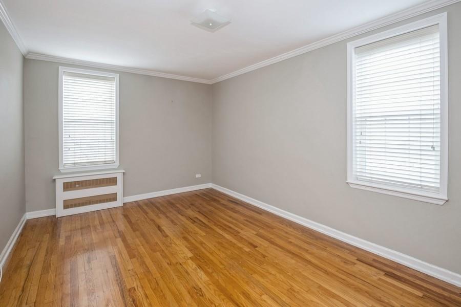 6665 Colonial Road, Unit 2F Brooklyn, NY 11220 - Photo 15 of 25 wooden floor in an empty room with a window
