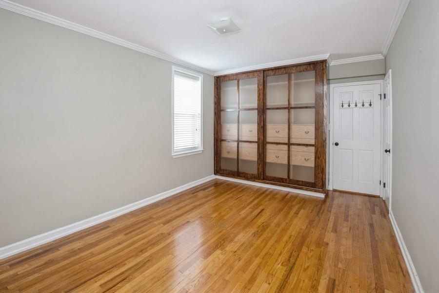 6665 Colonial Road, Unit 2F Brooklyn, NY 11220 - Photo 16 of 25 wooden floor in an empty room with a window