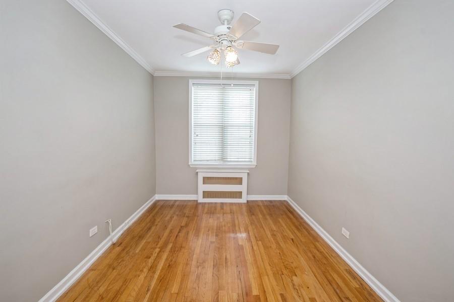 6665 Colonial Road, Unit 2F Brooklyn, NY 11220 - Photo 17 of 25 wooden floor in an empty room with a window