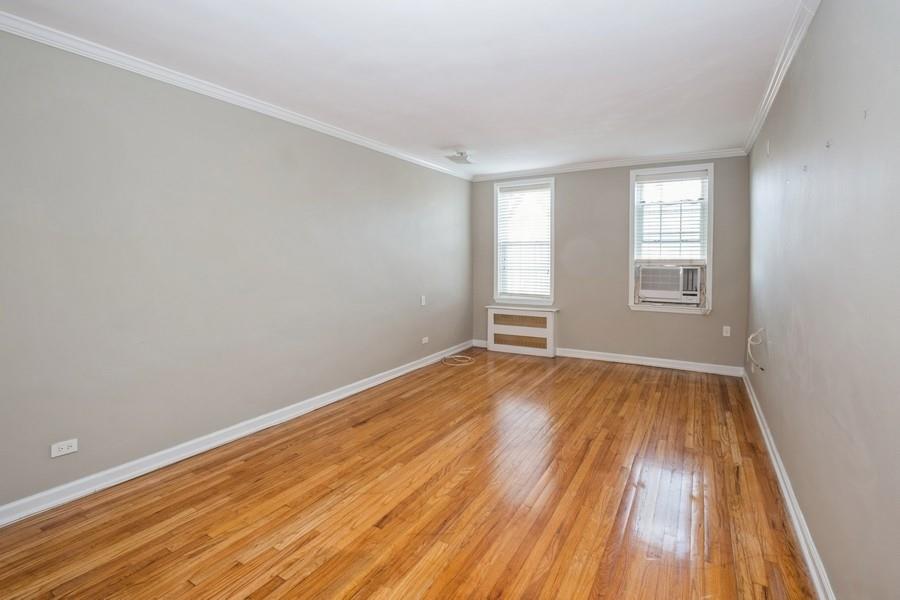 6665 Colonial Road, Unit 2F Brooklyn, NY 11220 - Photo 7 of 25 wooden floor in an empty room with a window