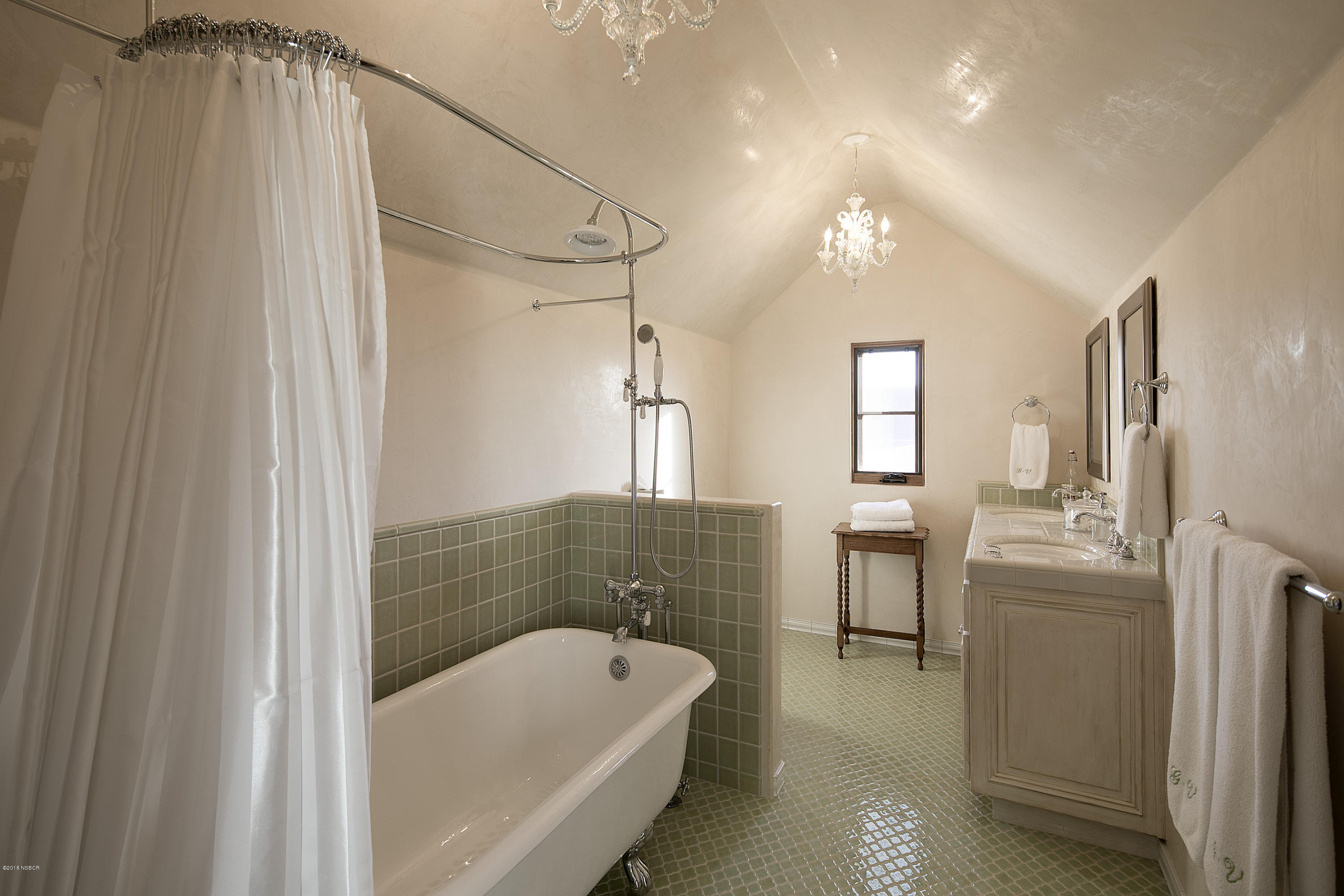1775 Still Meadow Road Solvang, CA 93463 - Photo 18 of 28 a bathroom with a tub a sink and mirror