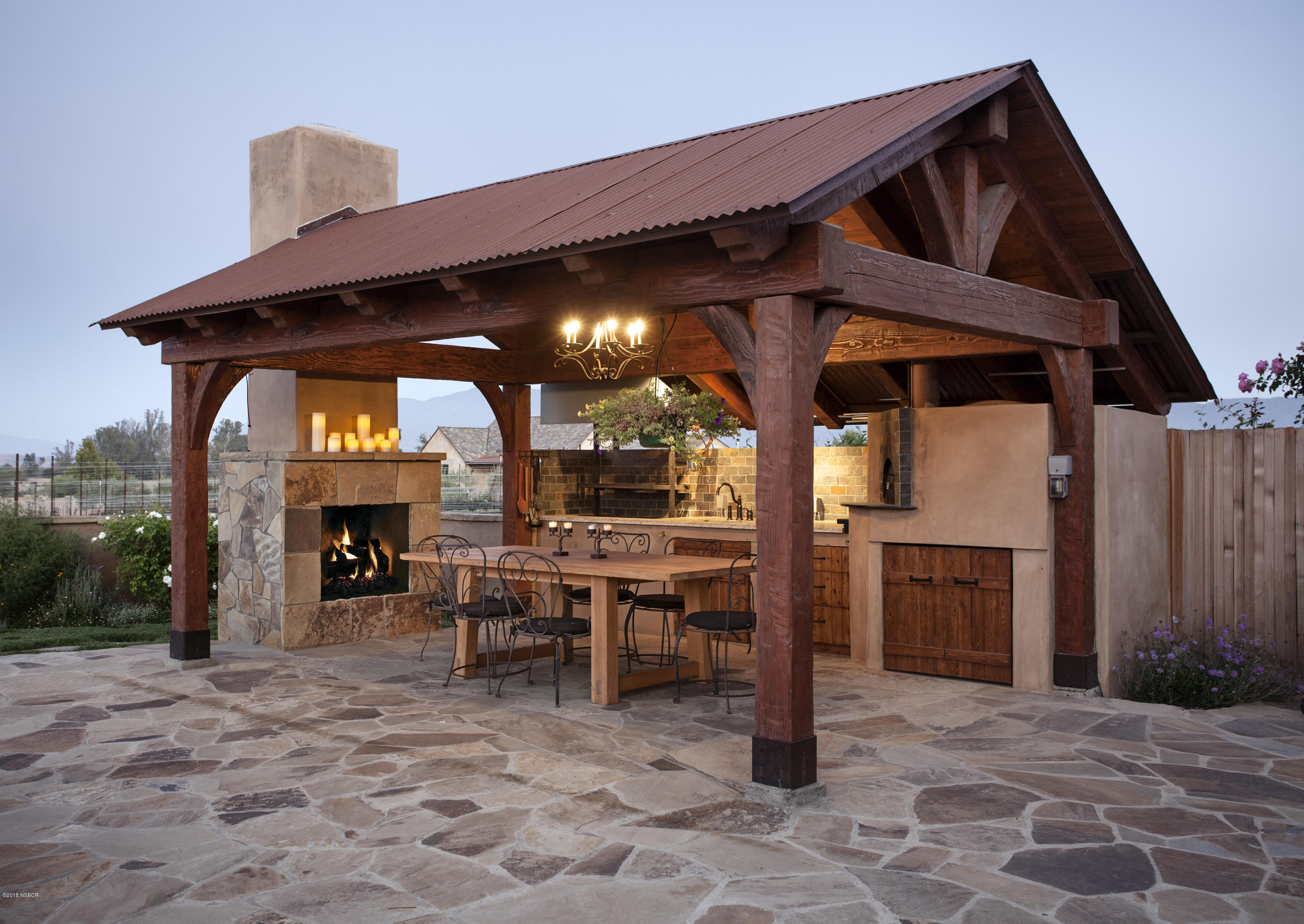 1775 Still Meadow Road Solvang, CA 93463 - Photo 20 of 28 a view of a dinning table and chairs in the patio