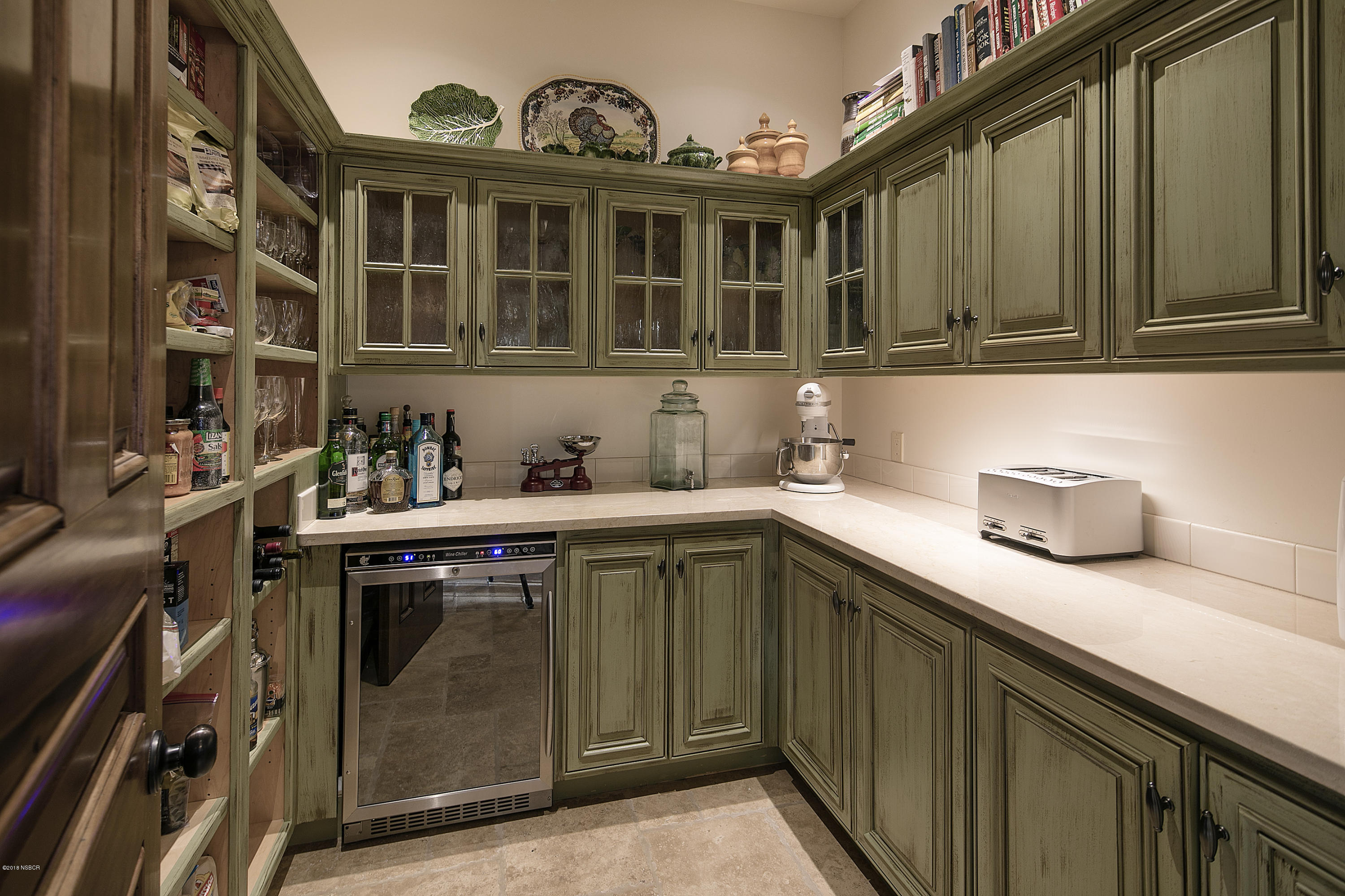 1775 Still Meadow Road Solvang, CA 93463 - Photo 8 of 28 a kitchen with a sink cabinets and a stove top oven