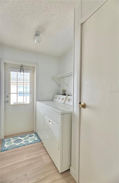 1100 South Belcher Road, Unit 391 Largo, FL 33771 - Photo 16 of 60 a room with a washer and dryer