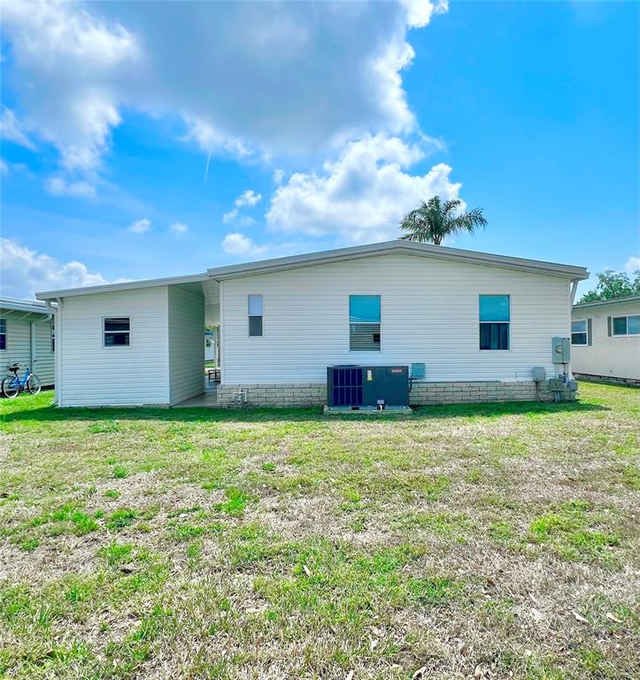 1100 South Belcher Road, Unit 391 Largo, FL 33771 - Photo 35 of 60 a house view with a backyard space