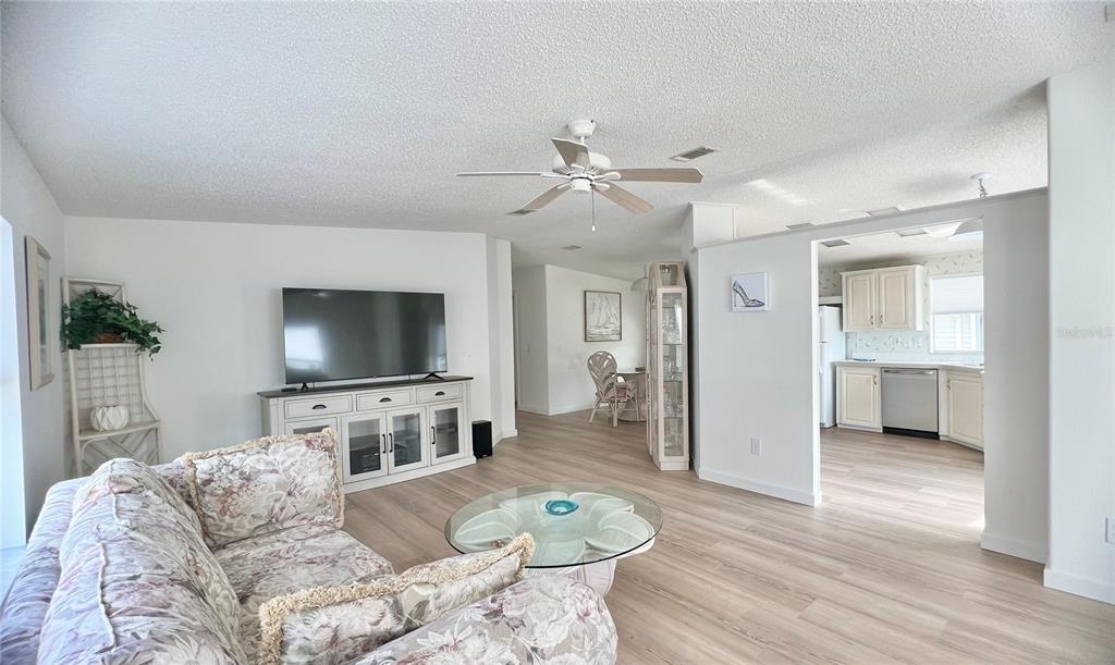 1100 South Belcher Road, Unit 391 Largo, FL 33771 - Photo 9 of 60 a living room with furniture and a flat screen tv