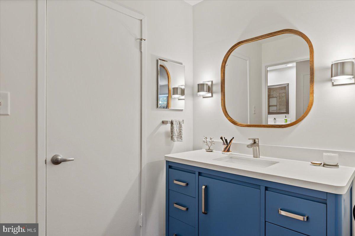 9411 Fernwood Road Bethesda, MD 20817 - Photo 18 of 28 a bathroom with a sink and a mirror