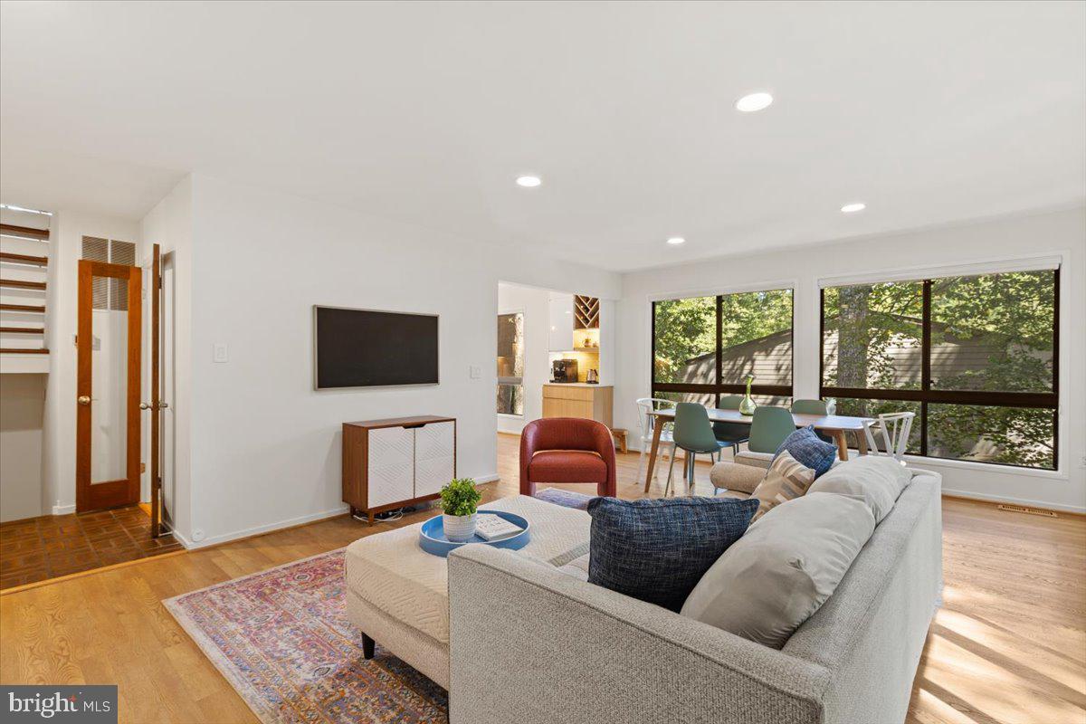 9411 Fernwood Road Bethesda, MD 20817 - Photo 7 of 28 a living room with furniture and a flat screen tv