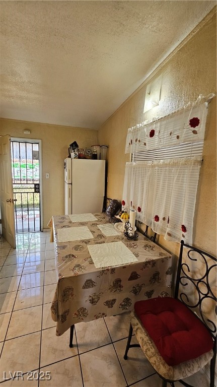 2120 Glider Street North Las Vegas, NV 89030 - Photo 22 of 50 Bedroom featuring fridge, lofted ceiling, a textur