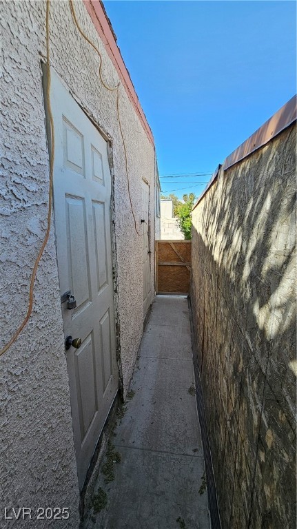 2120 Glider Street North Las Vegas, NV 89030 - Photo 29 of 50 View of side of property with stucco siding and fe