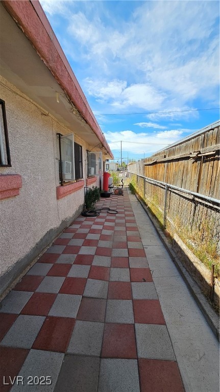 2120 Glider Street North Las Vegas, NV 89030 - Photo 33 of 50 View of patio featuring cooling unit and fence