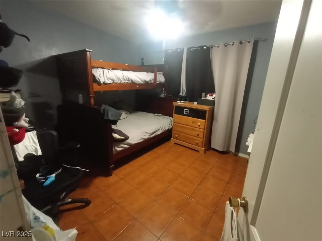 2120 Glider Street North Las Vegas, NV 89030 - Photo 39 of 50 Bedroom featuring light tile patterned floors