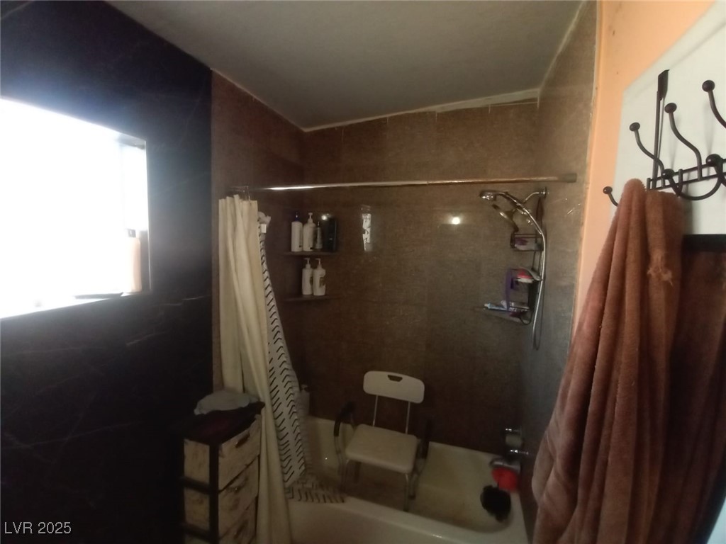 2120 Glider Street North Las Vegas, NV 89030 - Photo 46 of 50 Full bathroom featuring shower / tub combo with cu
