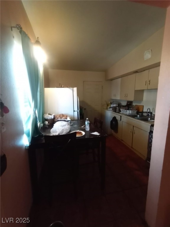 2120 Glider Street North Las Vegas, NV 89030 - Photo 48 of 50 Kitchen featuring vaulted ceiling, white cabinetry