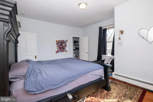a room with wooden floor and furniture