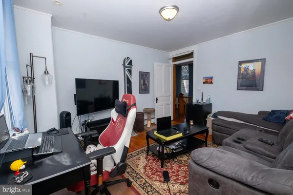 a bed sitting in a room next to a window