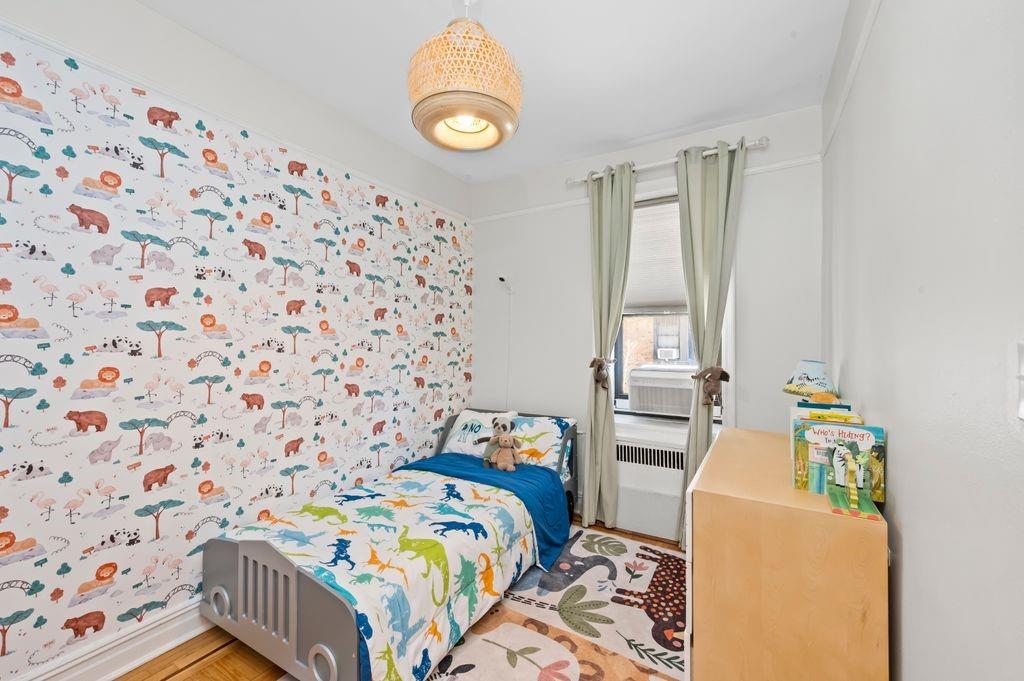 9701 Shore Road, Unit 1O Brooklyn, NY 11209 - Photo 12 of 23 a bedroom with a bed and a window