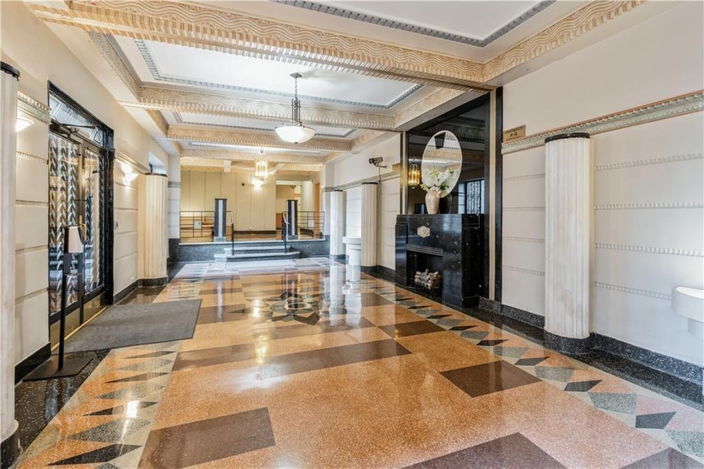 9701 Shore Road, Unit 1O Brooklyn, NY 11209 - Photo 16 of 23 a view of a lobby with a couch and a rug