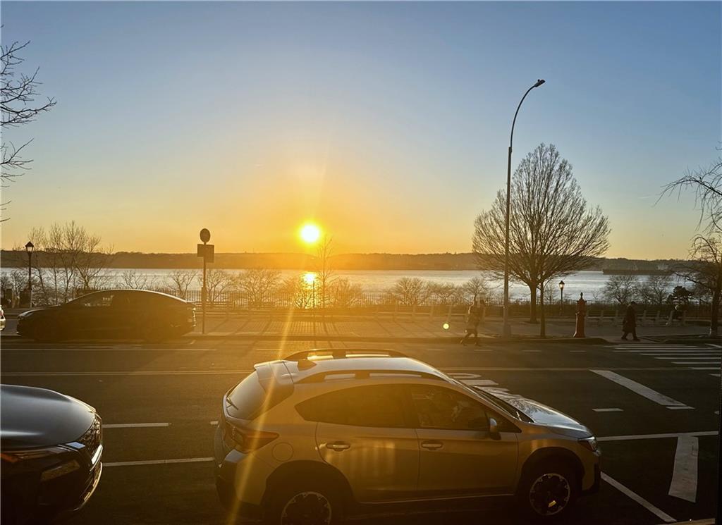9701 Shore Road, Unit 1O Brooklyn, NY 11209 - Photo 18 of 23 a car parked on the side of a river