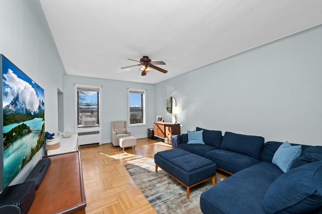 9701 Shore Road, Unit 1O Brooklyn, NY 11209 - Photo 7 of 23 a living room with furniture and a flat screen tv