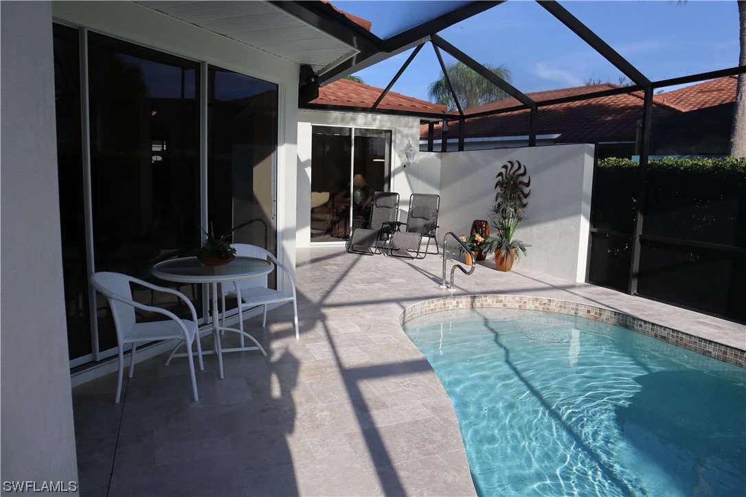 10325 Cape Roman Road, Unit 101 Estero, FL 34135 - Photo 23 of 34 an outdoor space with seating