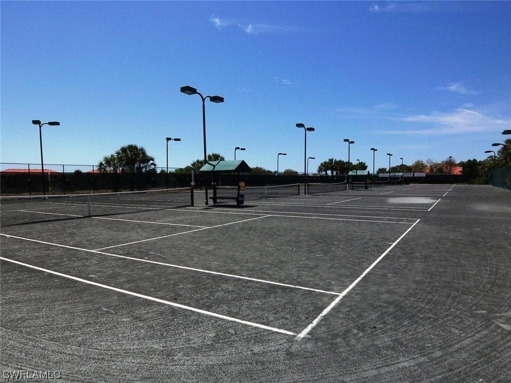 10325 Cape Roman Road, Unit 101 Estero, FL 34135 - Photo 32 of 34 a view of a tennis court