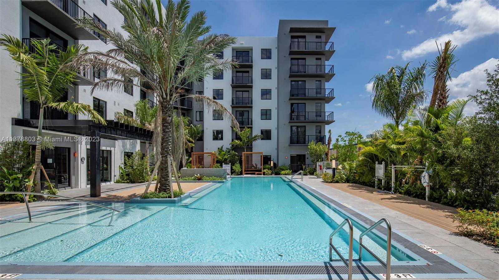 6970 Southwest 40th Street, Unit 442 Miami, FL 33155 - Photo 22 of 23 a view of a building with a swimming pool