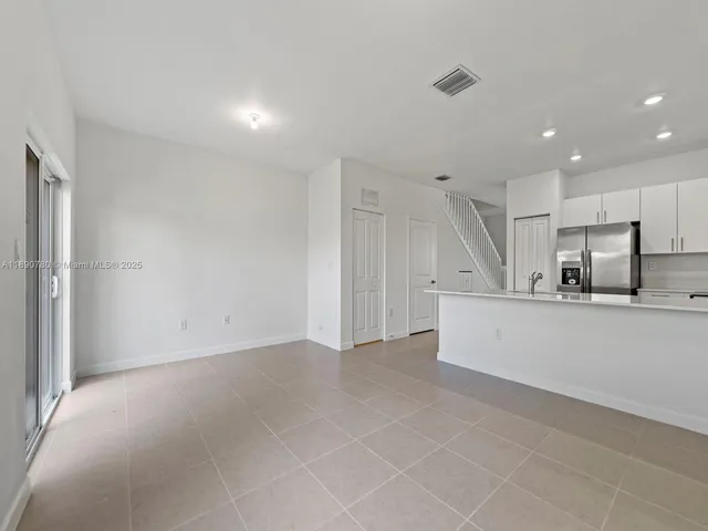 a view of kitchen with stainless steel appliances refrigerator oven