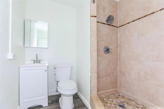 a bathroom with a toilet sink and shower