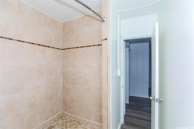 a bathroom with a glass shower door