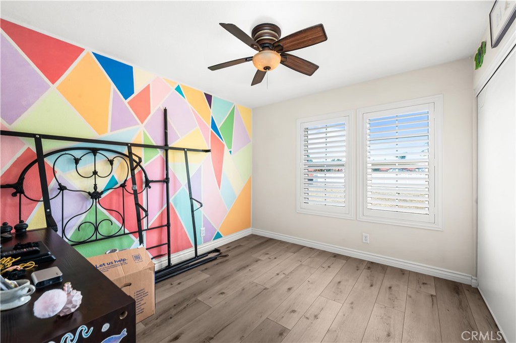 19465 Kinnow Lane Riverside, CA 92508 - Photo 33 of 61 wooden floor in a room with white walls and ceiling fan