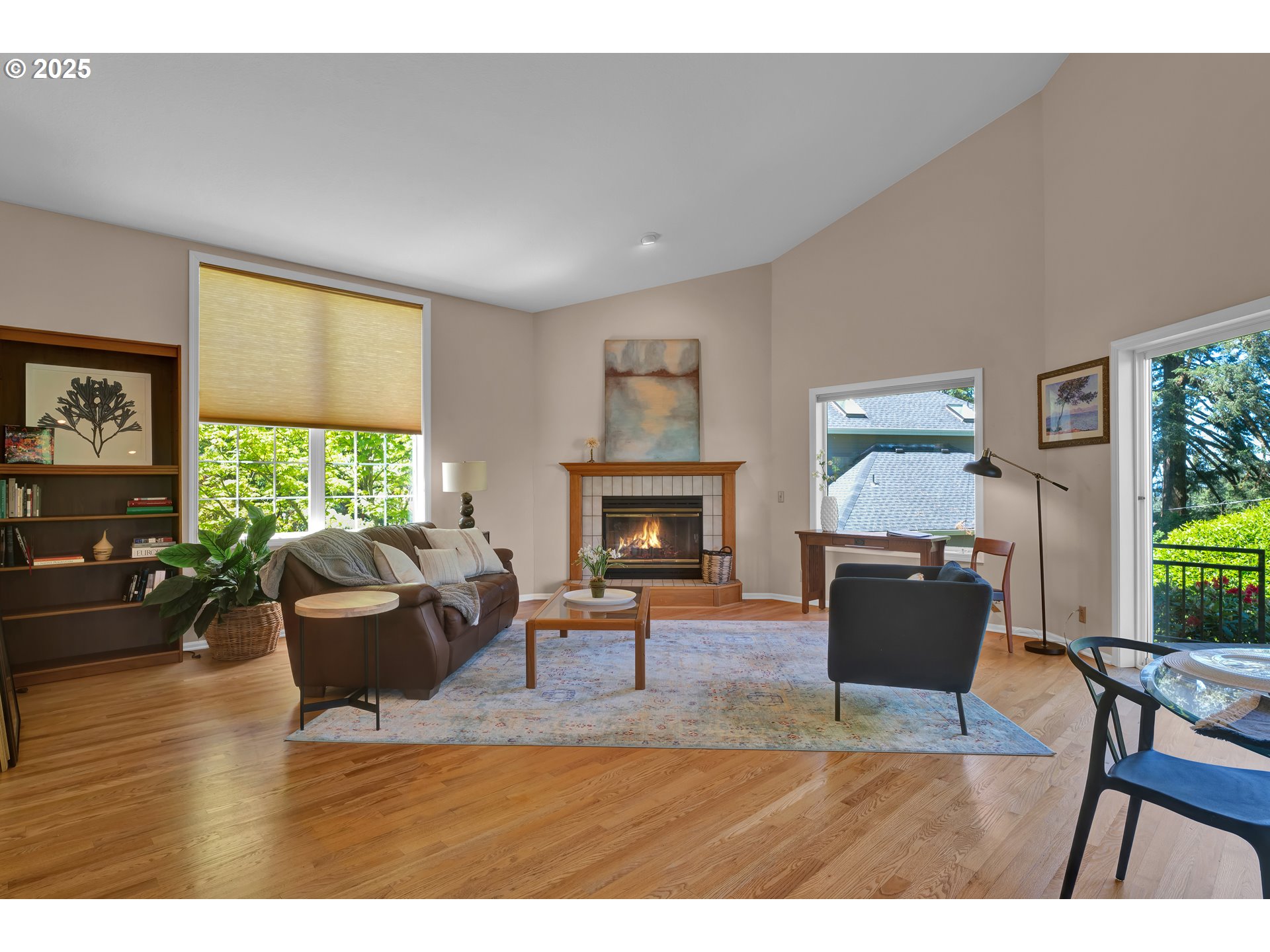 3348 Storey Boulevard Eugene, OR 97405 - Photo 13 of 47 a living room with furniture a window and a fireplace
