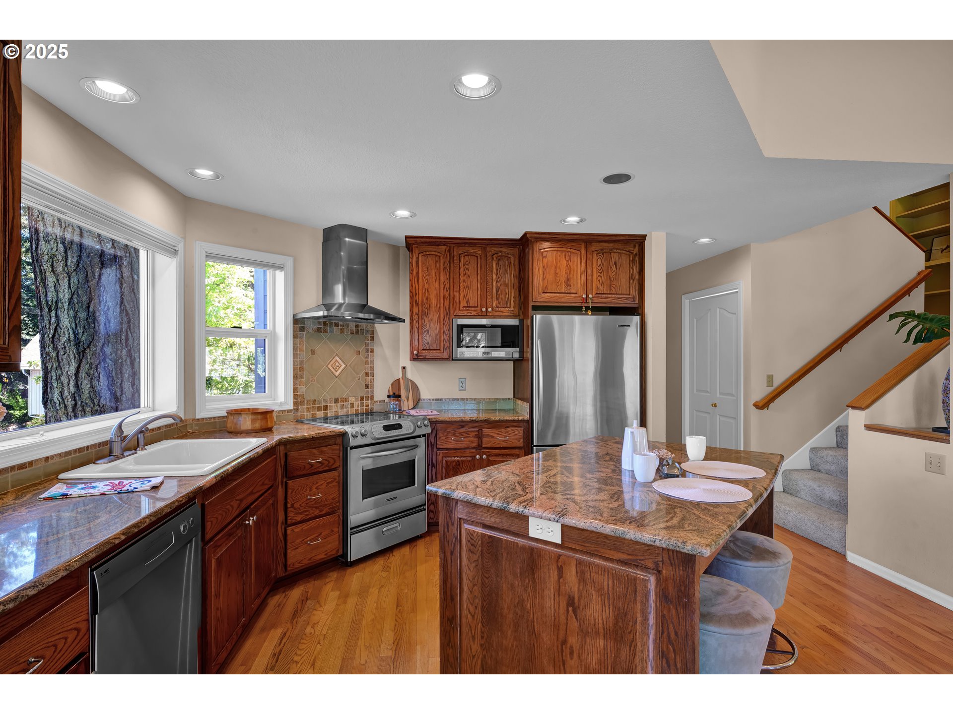 3348 Storey Boulevard Eugene, OR 97405 - Photo 17 of 47 a kitchen with granite countertop a sink stove and refrigerator