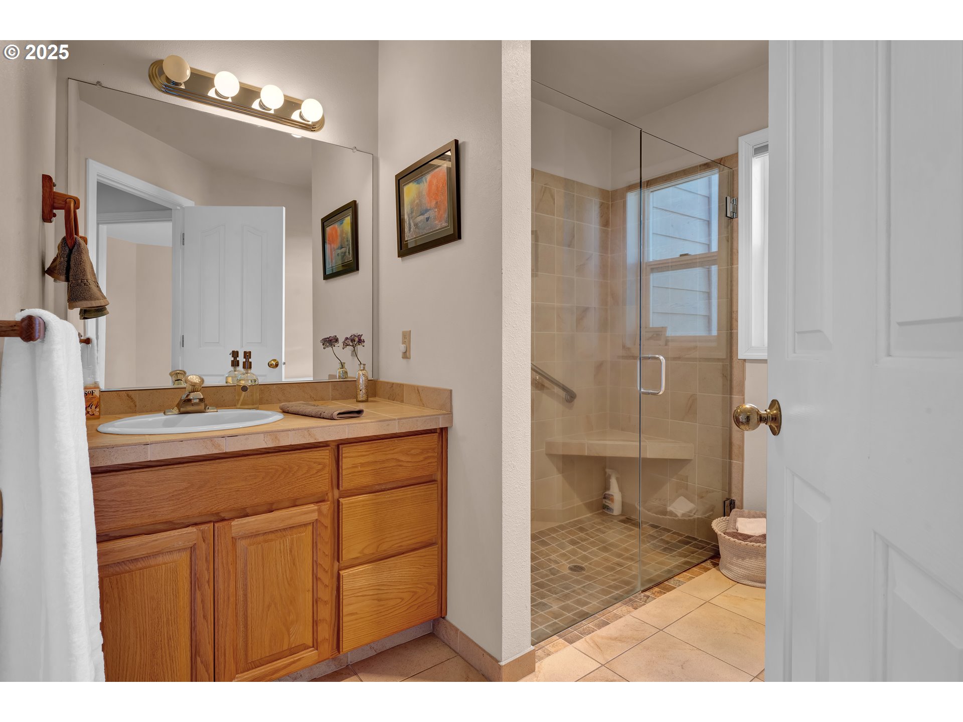 3348 Storey Boulevard Eugene, OR 97405 - Photo 32 of 47 a bathroom with a granite countertop sink mirror and shower