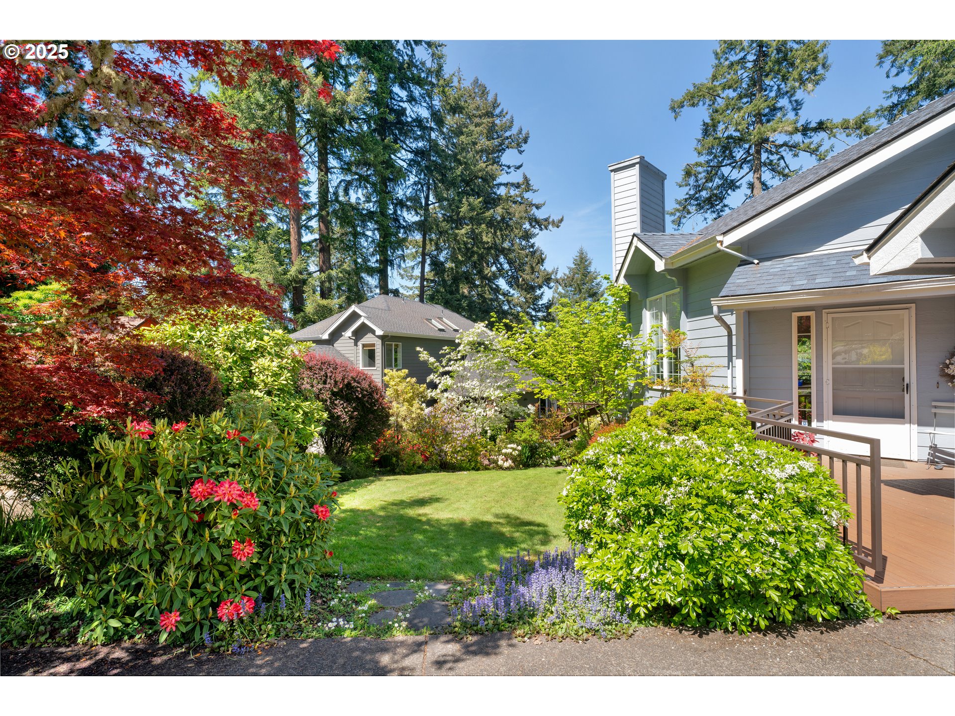 3348 Storey Boulevard Eugene, OR 97405 - Photo 6 of 47 a view of a garden with plants and flowers