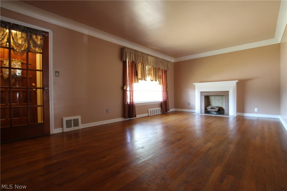 1405 South Green Road Cleveland, OH 44121 - Photo 8 of 29 Refinished Living Room Floor with Architectual Faux Fireplace...
