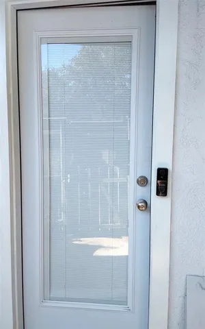 a bathroom with a glass shower door