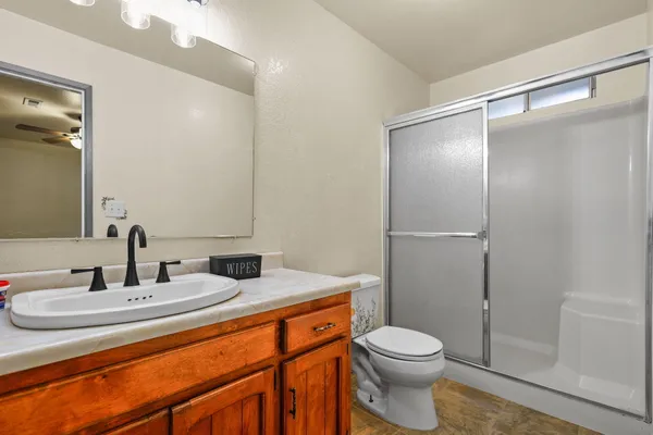 a bathroom with a sink toilet and shower