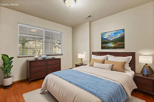 a bedroom with a bed and a window