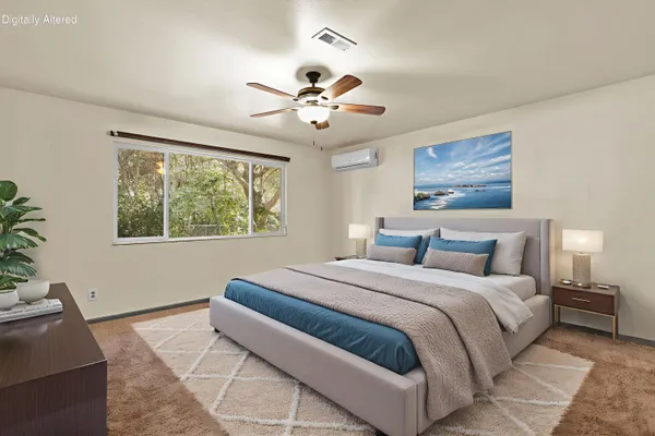 a bedroom with a large bed and a window